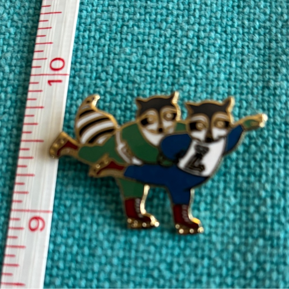 1979 Winter Olympics Vintage Raccoon Enamel Pin - Blue & Green Ice Skating